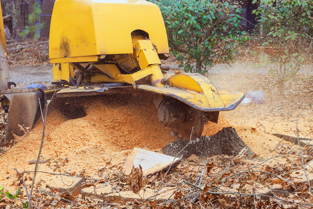 A large piece of equipment shredding wood